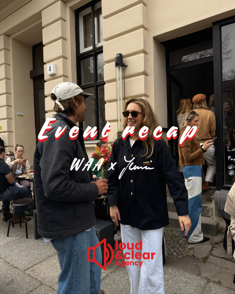 Zwei Personen lachen vor einem Event-Lokal in Berlin, mit „Event recap – WAA x Yumi“ Text-Overlay und Branding der Agentur Loud & Clear.